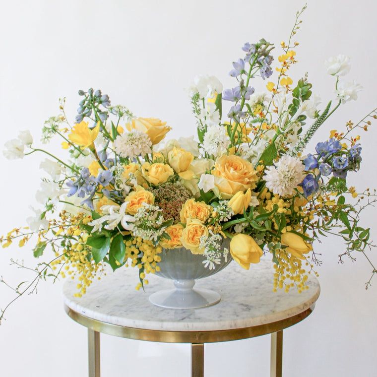 Florist creating a custom arrangement at Mobileworks